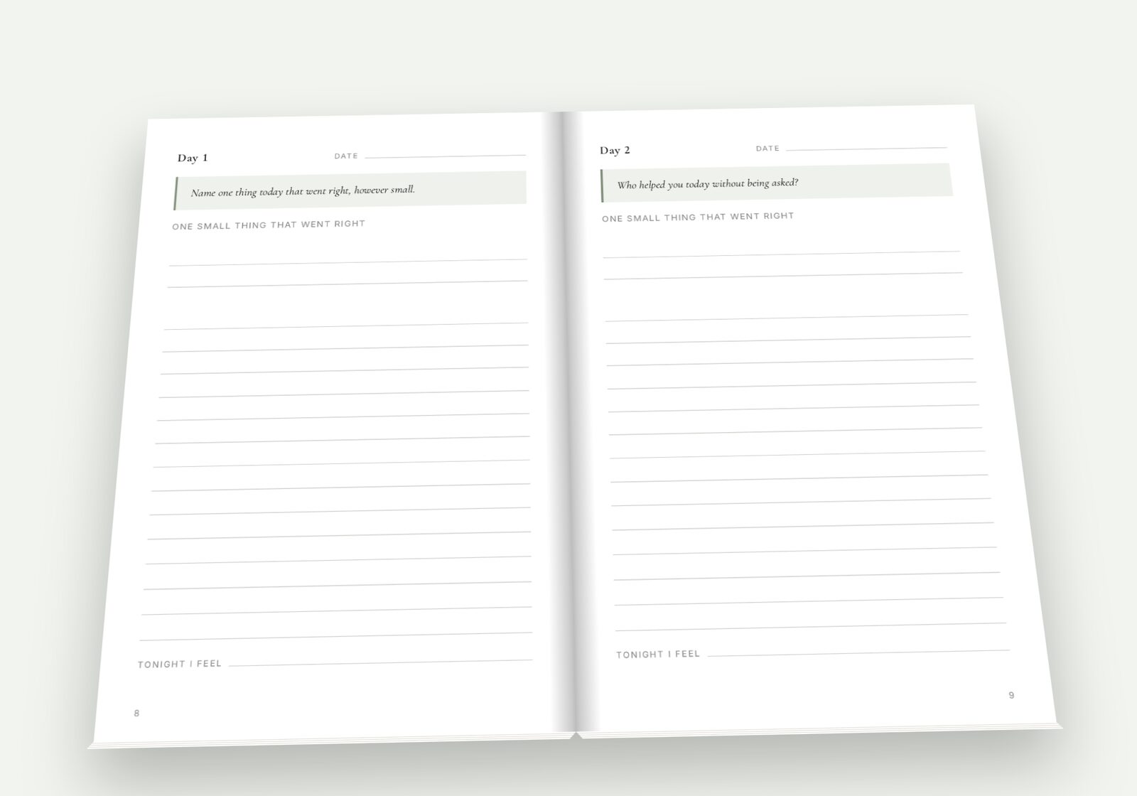 Still Here lying open on a table, showing a spread of the pages you fill in