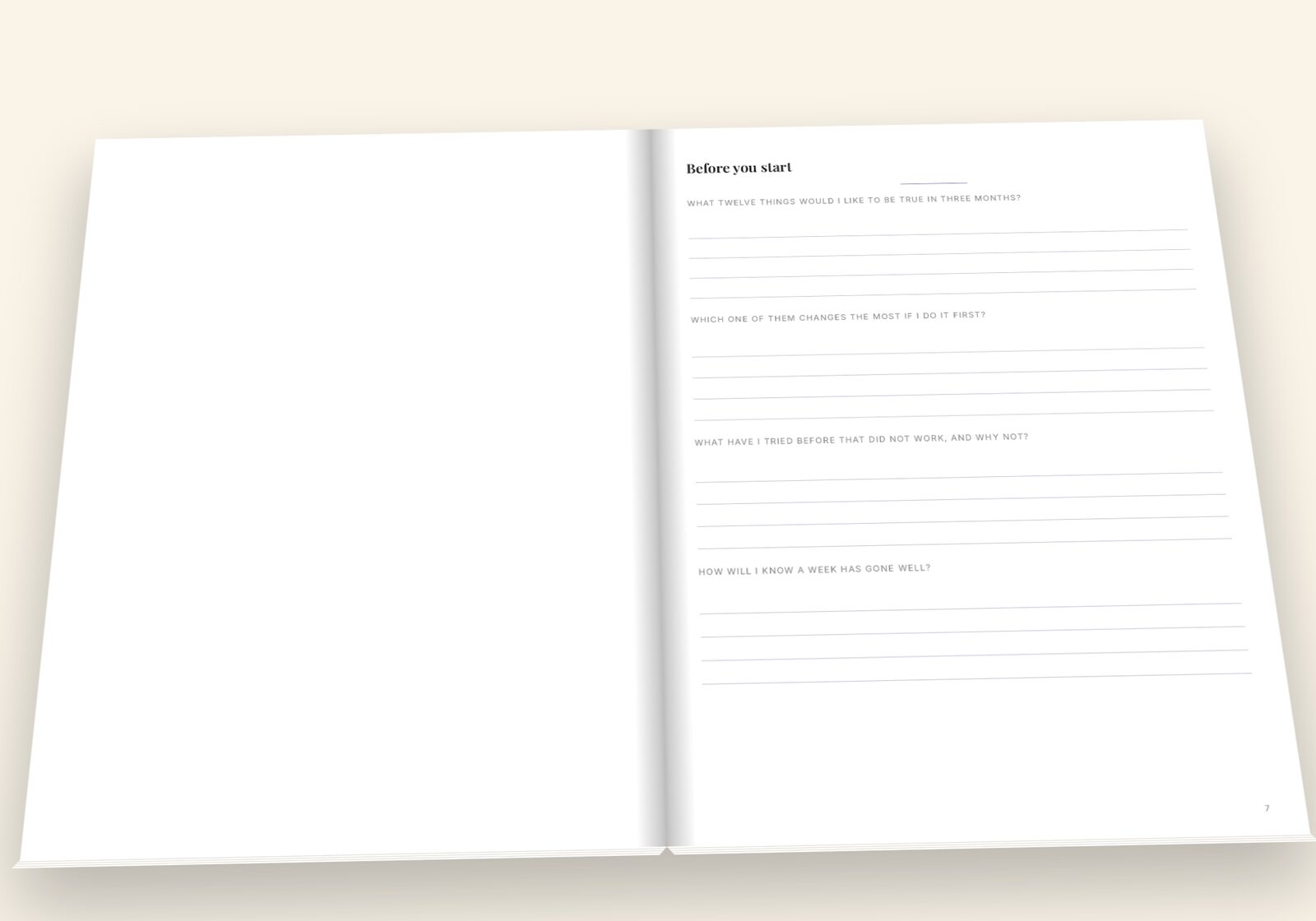 Ninety Days of Small Goals lying open on a table, showing a spread of the pages you fill in